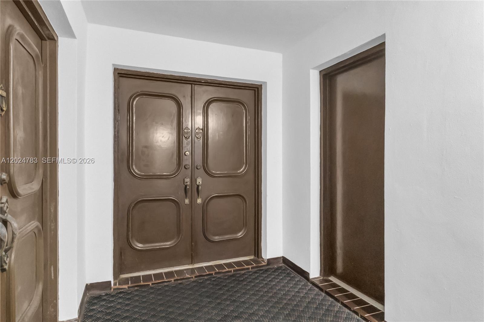 A double door with brown panels is centered in a white-walled entryway — 13951 Kendale Lakes Cir # 208A, Miami FL 33183, MIAMI, FL