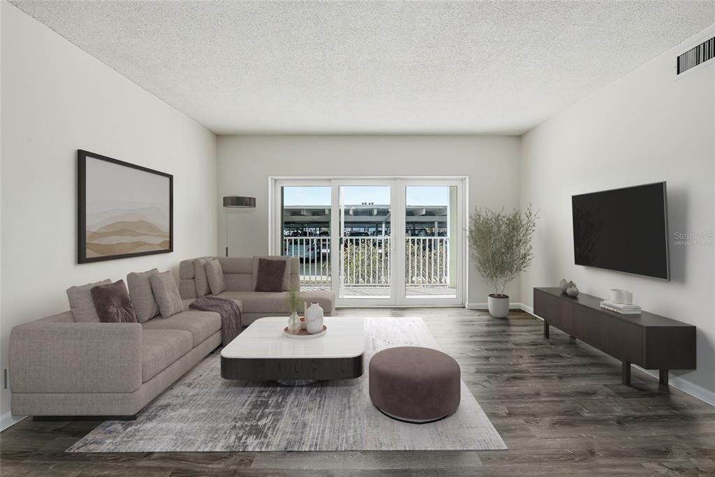 This is a virtual staging rendering of a living room with a sectional and TV — 420 64TH AVENUE UNIT 107, ST PETE BEACH, FL