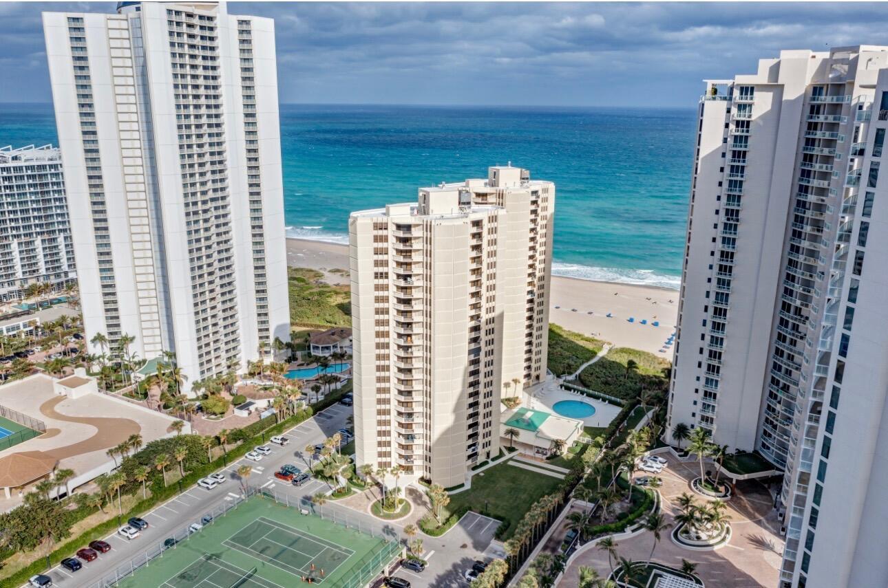 An aerial view shows three tall residential towers situated along a sandy beach and ocean — 2800 N Ocean Drive, Riviera Beach FL 33404, RIVIERA BEACH, FL