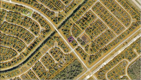 This is an aerial map showing a highlighted residential lot within a suburban neighborhood — MANSFIELD CIRCLE, NORTH PORT, FL