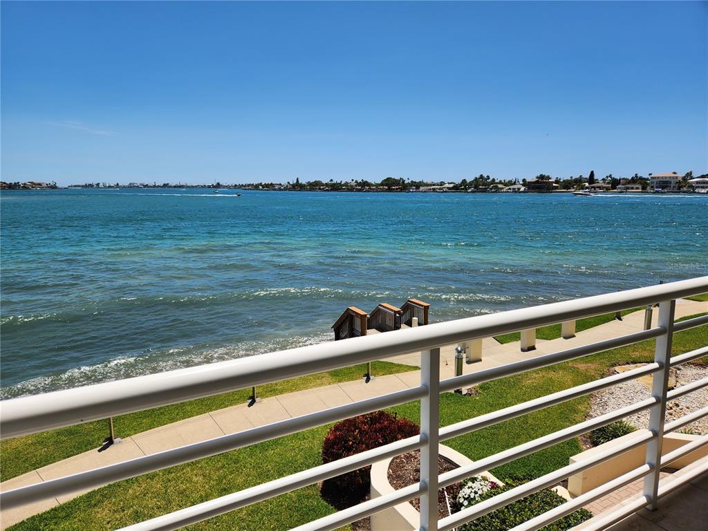 A view of a blue bay from a balcony with a white metal railing — 6105 BAHIA DEL MAR CIRCLE UNIT 283, ST PETERSBURG, FL