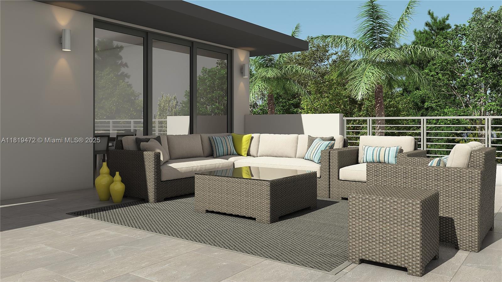 This is a rendering of a modern outdoor patio featuring wicker furniture on a rug — 5548 Canal Dr # 13, Lake Worth FL 33463, LAKE WORTH, FL