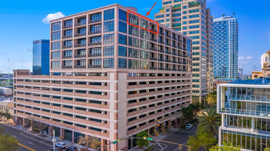An exterior view of a multi-story building with a parking garage base and residential units — 175 2ND STREET S UNIT P-08, ST PETERSBURG, FL