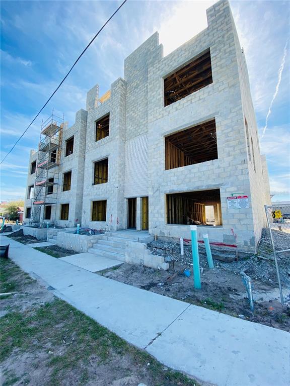 An exterior view of a multi-story concrete block building under construction with scaffolding — 4723 W PRICE AVENUE UNIT 2, TAMPA, FL
