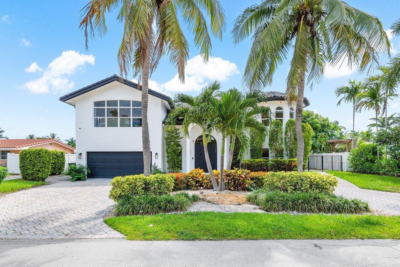 A two-story white house with a dark garage and palm trees in the front yard — 1366 SW 4th Court, Boca Raton FL 33432, BOCA RATON, FL