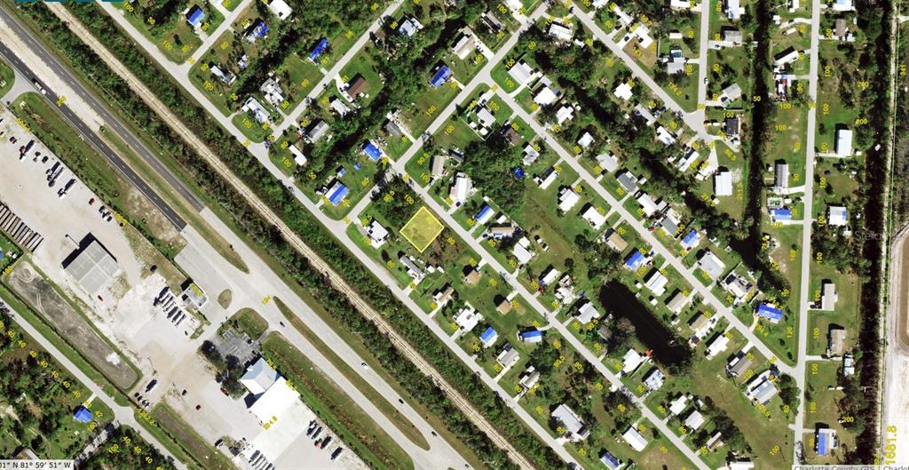 An aerial map view shows a vacant residential lot highlighted in yellow within a neighborhood — 11285 PEPPER ROAD, PUNTA GORDA, FL