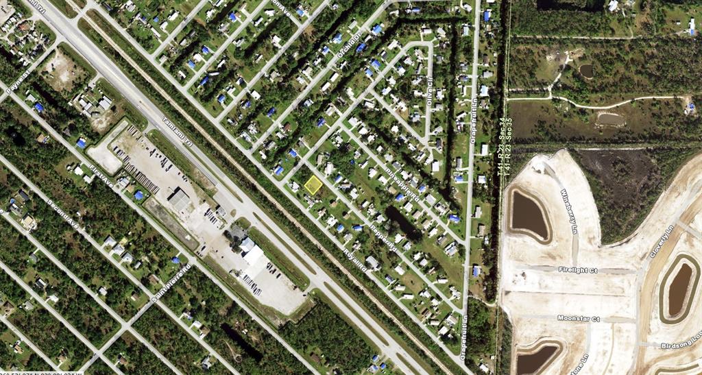 This is an aerial map view of a residential neighborhood with a highlighted property lot — 11285 PEPPER ROAD, PUNTA GORDA, FL