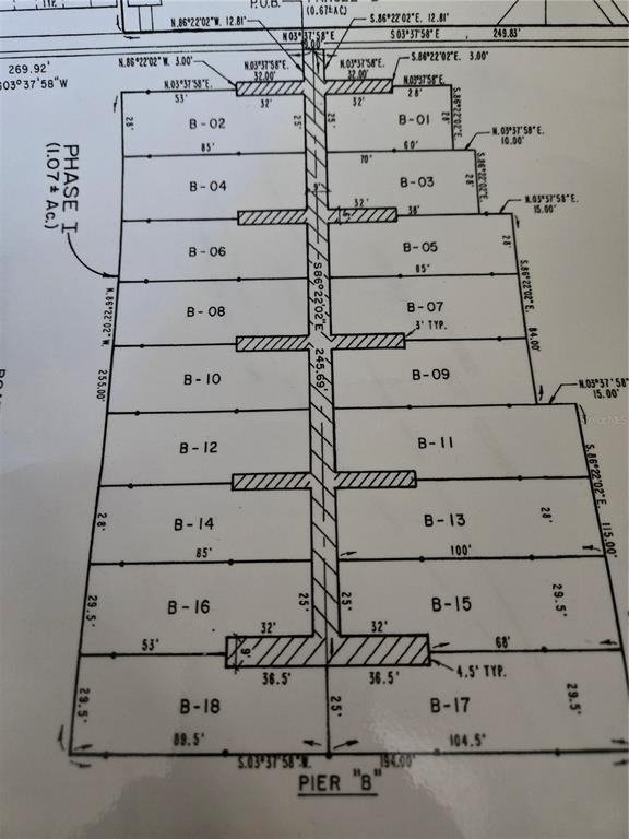 This is a survey map showing the layout of boat slips labeled B-01 through B-18 — 2600 HARBOURSIDE DRIVE UNIT B-13, LONGBOAT KEY, FL
