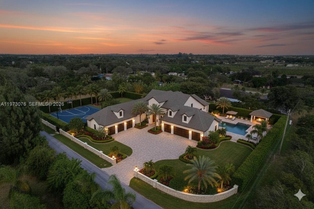 An aerial view shows a large house with a basketball court, pool, and paved driveway — 25730 SW 153 CT, Unincorporated Dade County FL 33032, UNINCORPORATED DADE COUNTY, FL