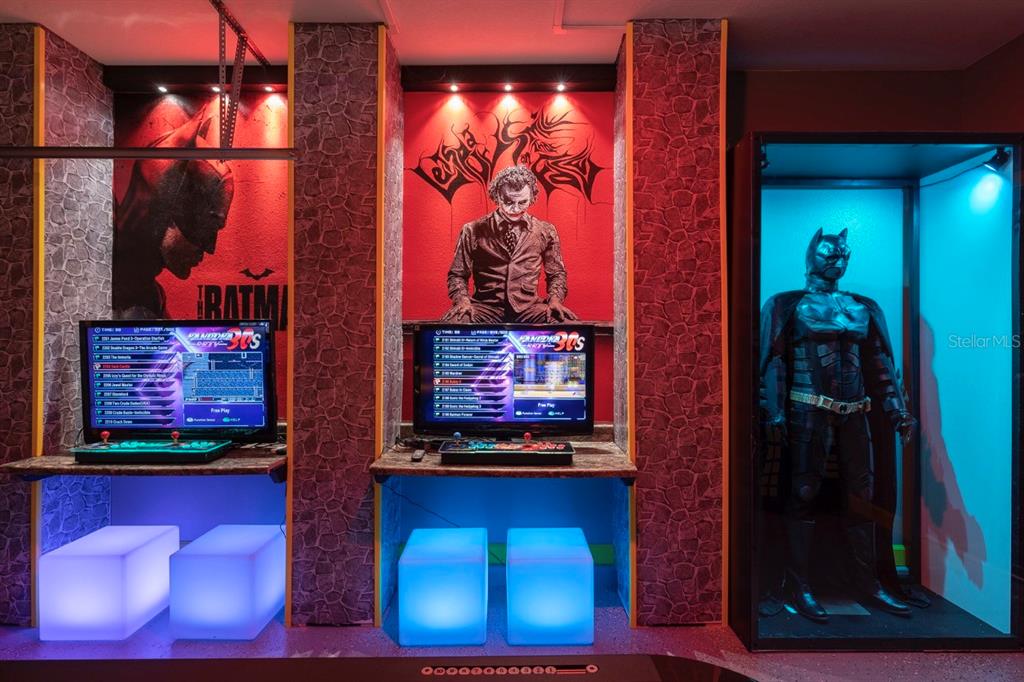 A Batman-themed game room features two arcade stations and a life-sized Batman suit in a display — 3004 PROTAGONIST STREET, KISSIMMEE, FL