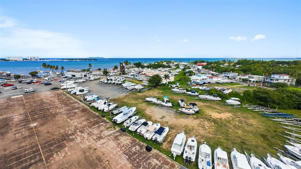 An aerial view shows a large boat storage yard with numerous vessels parked on trailers — . TABLAZO UNIT 507, FAJARDO, PR