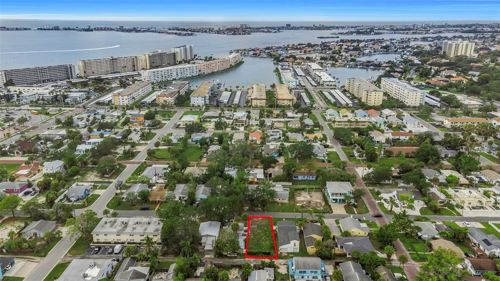 An aerial view shows a vacant rectangular lot outlined in red within a residential neighborhood — 3020 CLINTON STREET S, GULFPORT, FL