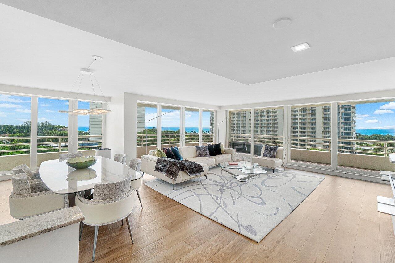 A bright open-concept living and dining area with floor-to-ceiling windows overlooking the ocean — 4201 N Ocean Boulevard # 601, Boca Raton FL 33431, BOCA RATON, FL