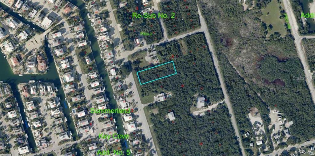 An aerial map view shows a rectangular vacant lot highlighted in blue within a neighborhood — SUNSET BOULEVARD, SUMMERLAND KEY, FL