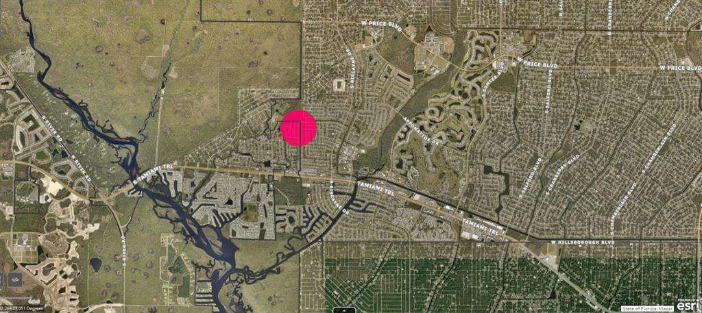 This is a satellite map showing a residential area with a pink circle highlighting property — GRANADA BOULEVARD, NORTH PORT, FL