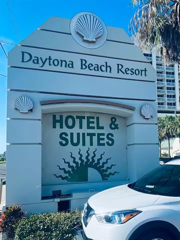 A white monument sign for the Daytona Beach Resort Hotel & Suites stands outdoors — 2700 N ATLANTIC AVENUE UNIT 1206, DAYTONA BEACH, FL