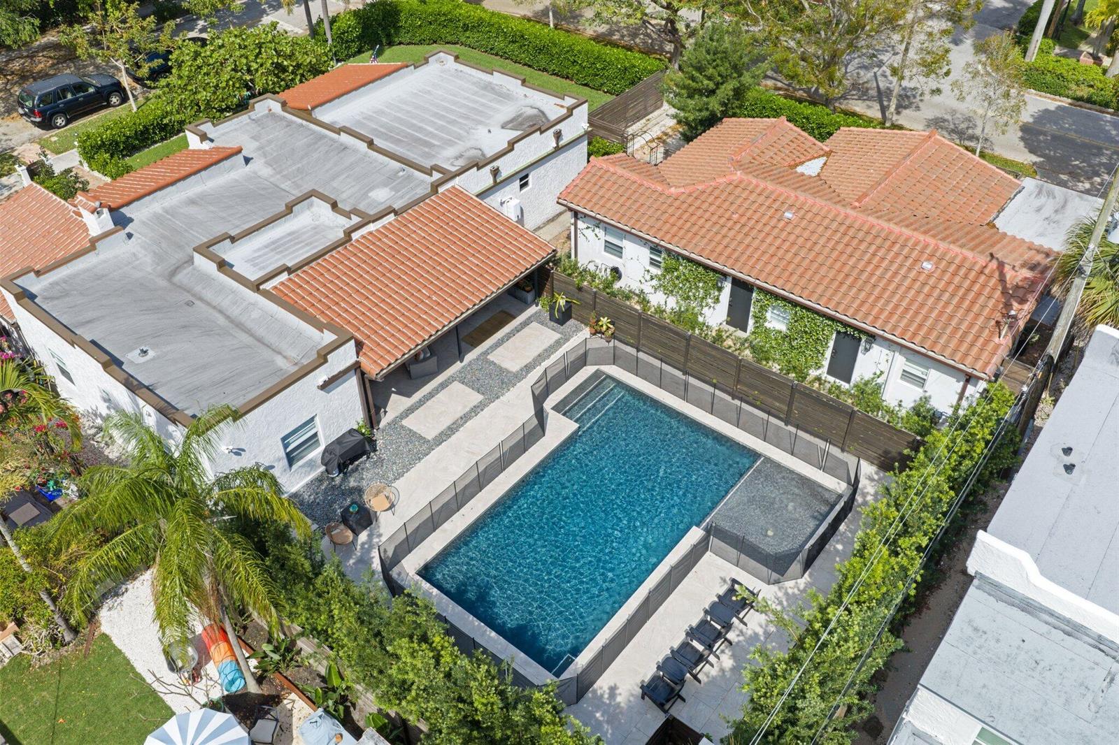 An aerial view shows a house with a tiled roof, a pool, and a fenced patio — 706 Sunset Road, West Palm Beach FL 33401, WEST PALM BEACH, FL