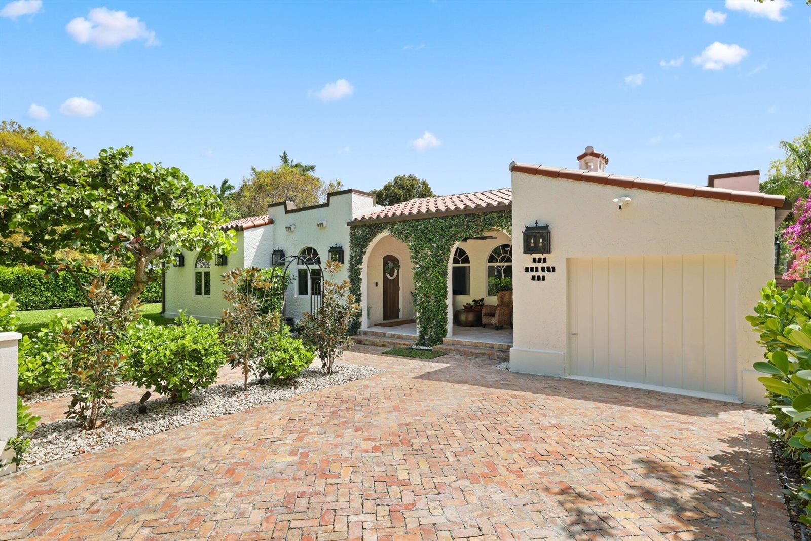 A single-story stucco house with a brick driveway, arched entryway, and ivy-covered facade — 706 Sunset Road, West Palm Beach FL 33401, WEST PALM BEACH, FL