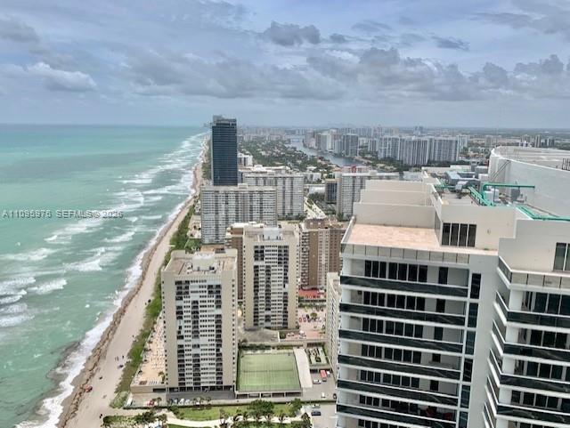 An elevated view of a coastal city with high-rise buildings along a sandy beach — 1830 S Ocean Dr # 4904, Hallandale Beach FL 33009, HALLANDALE BEACH, FL