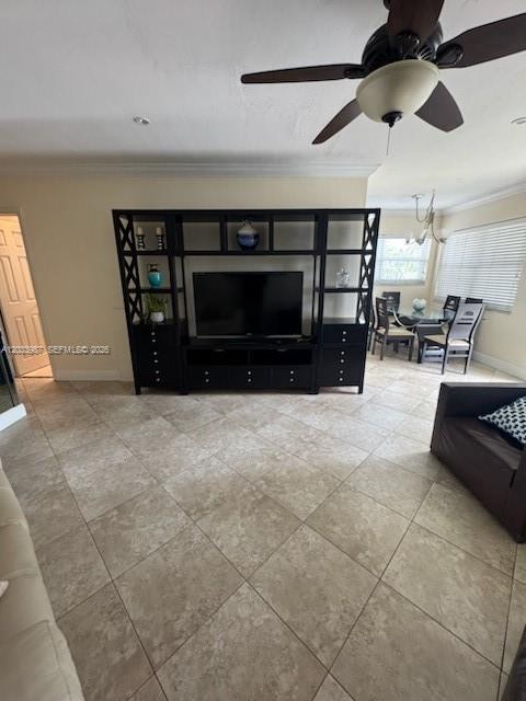 A living room features a large black entertainment center, tile flooring, and a ceiling fan — 500 Layne Blvd # 20, Hallandale Beach FL 33009, HALLANDALE BEACH, FL