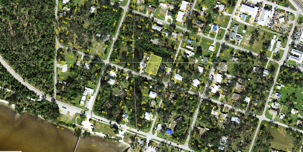This is an aerial map view showing a highlighted rectangular property lot in a neighborhood — 23024 CENTRAL AVENUE UNIT B, PUNTA GORDA, FL