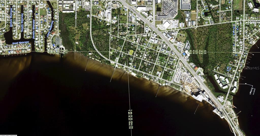 This is an aerial map view of a residential area along a waterfront — 23024 CENTRAL AVENUE UNIT B, PUNTA GORDA, FL
