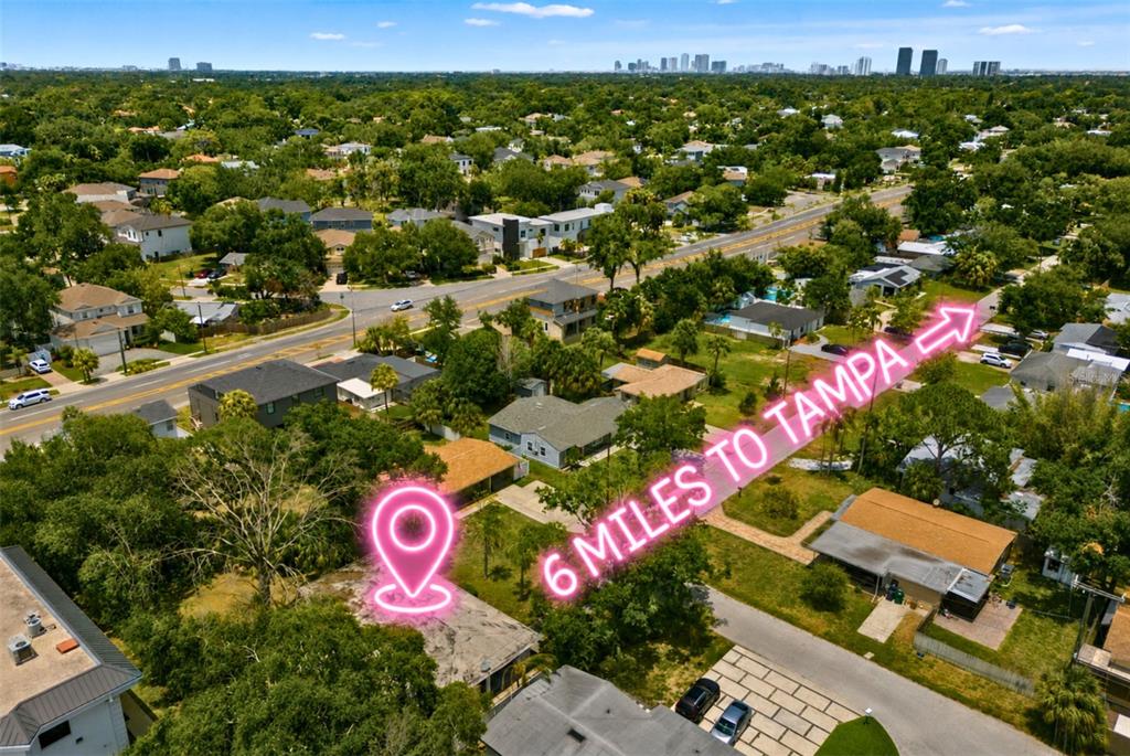 An aerial view shows a residential neighborhood with a highlighted property and surrounding houses — 4635 W BAY VILLA AVENUE, TAMPA, FL