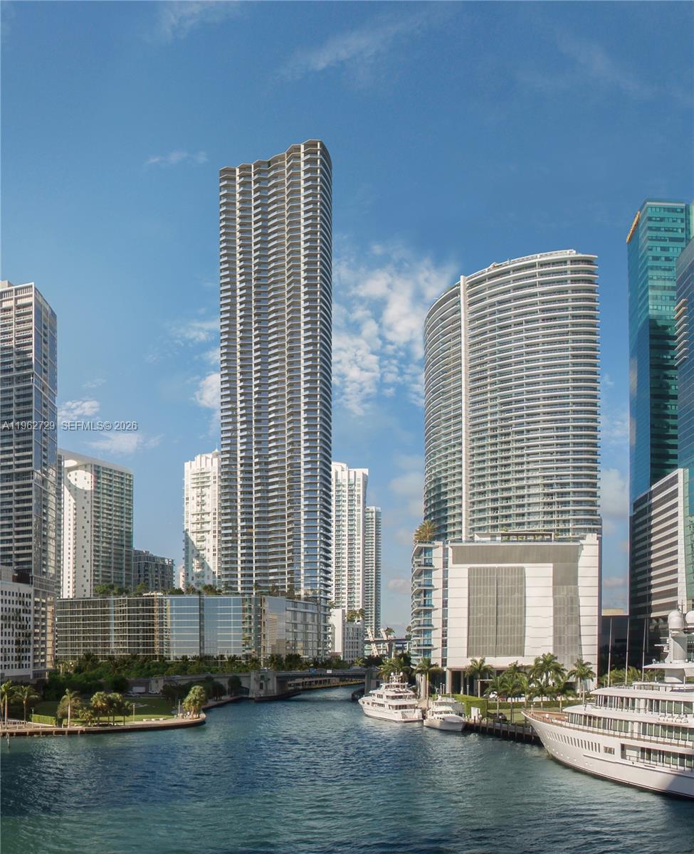 A view of a canal with yachts and several modern high-rise buildings in Miami — 99 SE 5th street, Miami FL 33131, MIAMI, FL