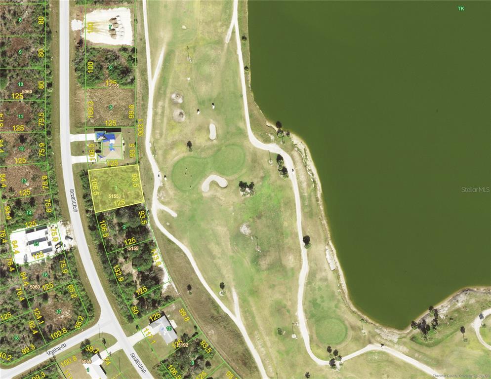 This is an aerial map showing residential lots along a golf course and a lake — 7266 DAVID BOULEVARD, PORT CHARLOTTE, FL