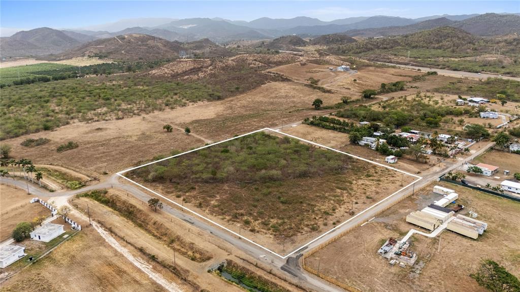 An aerial view shows a large, rectangular plot of land outlined in white — OBDULIA, SANTA ISABEL, PR