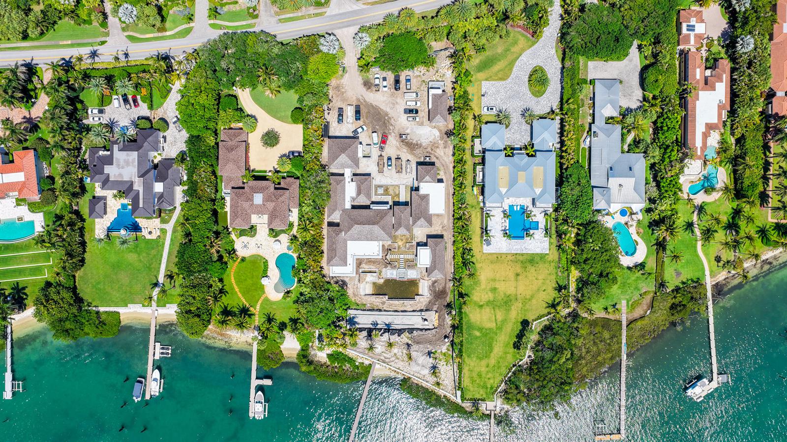 Aerial view of several waterfront luxury homes with swimming pools and private docks — 508 S Beach Road, Jupiter Island FL 33455, JUPITER ISLAND, FL