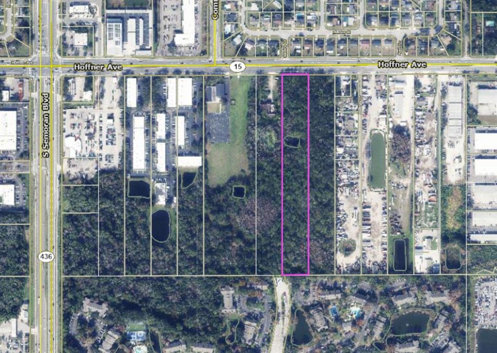 This aerial map shows a rectangular, wooded parcel of land highlighted in purple along a road — 5970 HOFFNER AVENUE, ORLANDO, FL