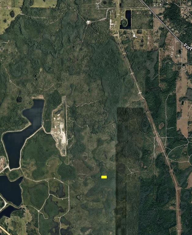 This is an aerial map view showing a small yellow rectangle marking a property location — DILL ROAD, ORLANDO, FL