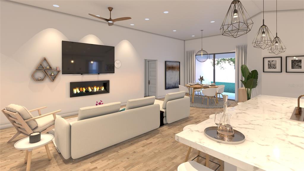 This rendering shows an open-concept living and dining area with a fireplace and kitchen island — 3189 FRANTZ AVENUE SW, PALM BAY, FL