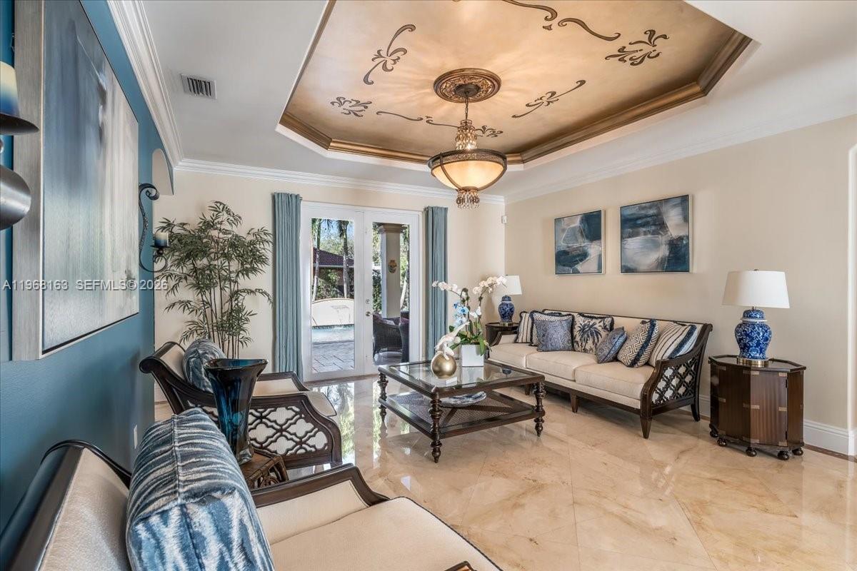 A living room features a tray ceiling with gold paint, tile floors, and patio doors — 7851 NW 166th Ter, Miami Lakes FL 33016, MIAMI LAKES, FL