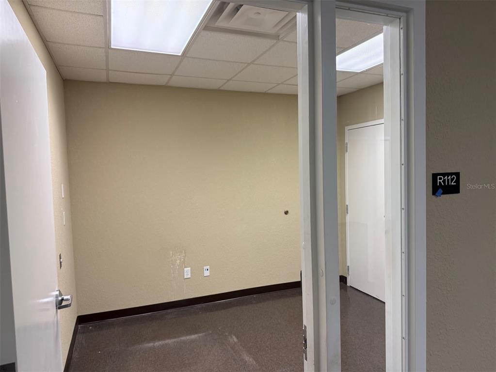 This is a floor plan showing the layout and emergency exit routes of a commercial building — 5431 E SILVER SPRINGS BOULEVARD UNIT C, SILVER SPRINGS, FL