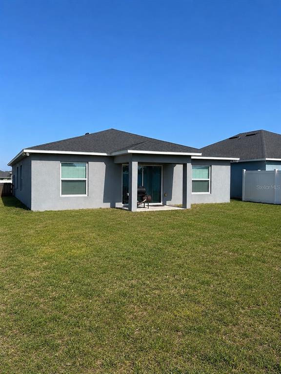 This is a floor plan for a single-story house with three bedrooms and a garage — 7259 HOLLY CREEK ROAD, MOUNT DORA, FL