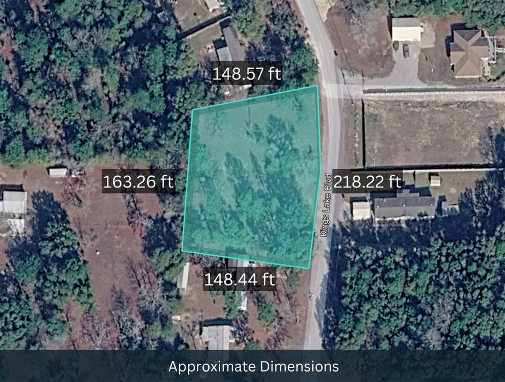 An aerial map shows the approximate dimensions of a vacant, wooded residential lot — 208 KINGS LAKE BOULEVARD, DEFUNIAK SPRINGS, FL