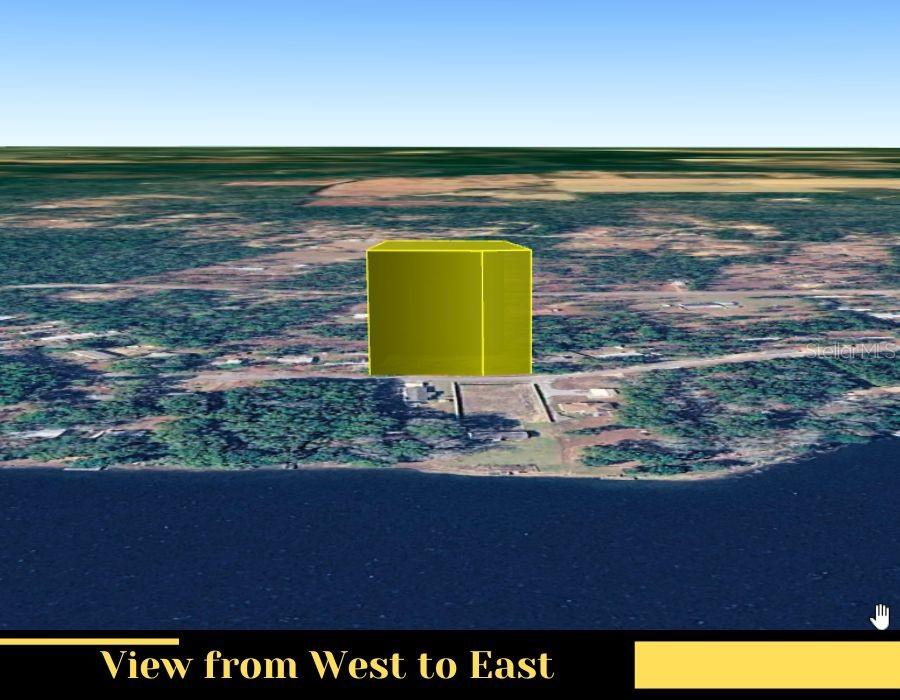 An aerial rendering shows a yellow rectangular prism marking a property location near a lake — 208 KINGS LAKE BOULEVARD, DEFUNIAK SPRINGS, FL