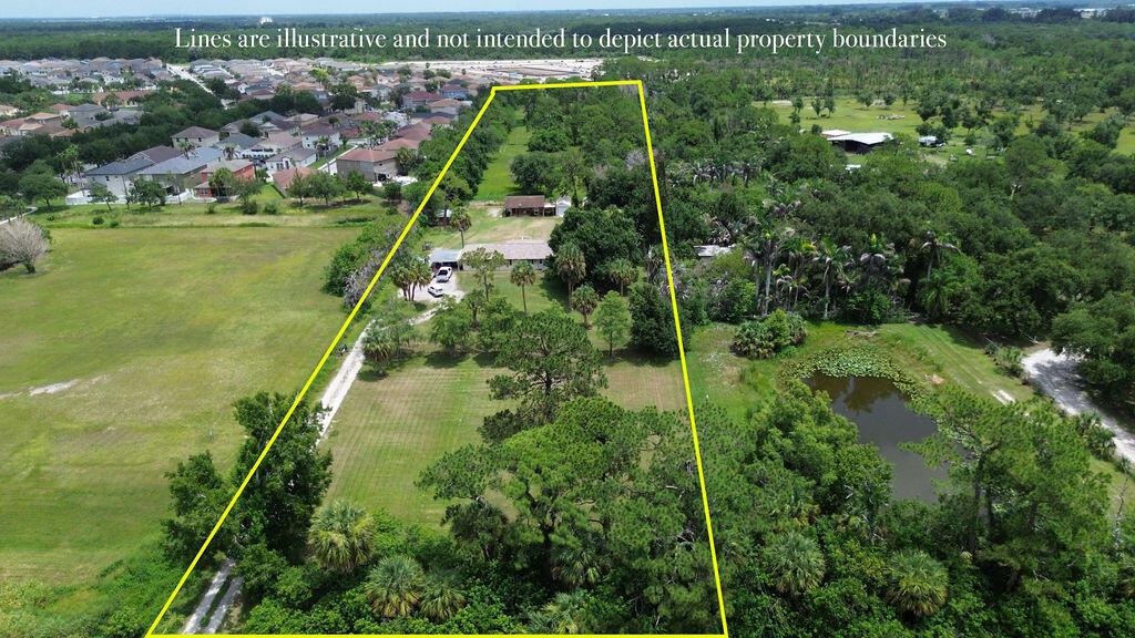 An aerial view shows a residential property with a house and trees outlined in yellow — 9302 Orange Avenue, Fort Pierce FL 34945, FORT PIERCE, FL
