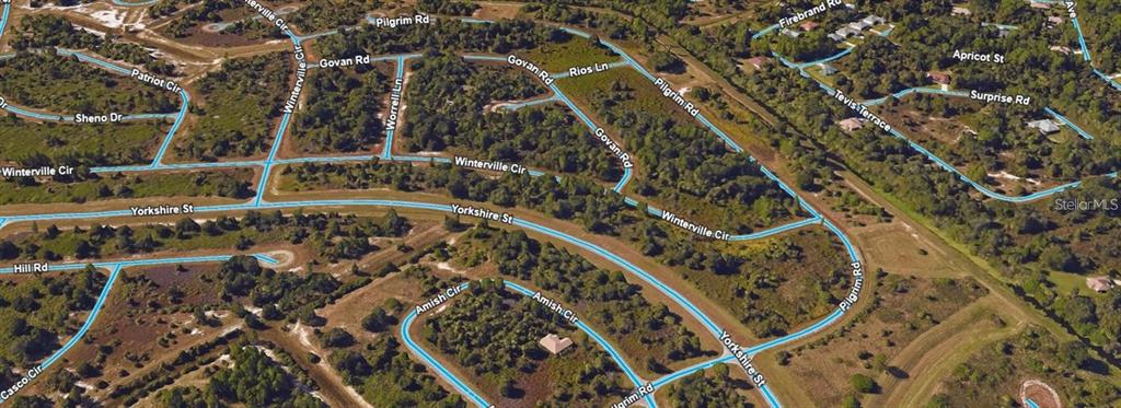 This is an aerial map view of a residential neighborhood with undeveloped lots and roads — Lot 14 LORING DRIVE, NORTH PORT, FL