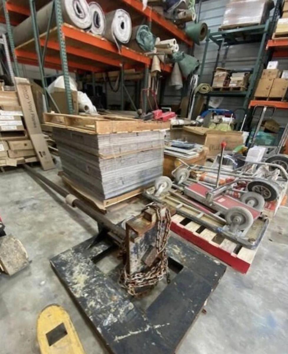 A warehouse interior featuring storage racks, stacked materials, a pallet jack, and industrial equipment — , West Palm Beach FL 33411, WEST PALM BEACH, FL