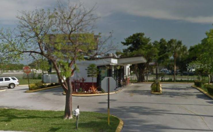 A small commercial building with a drive-thru lane and a parking lot — 4050 SW 21ST STREET, FORT LAUDERDALE, FL