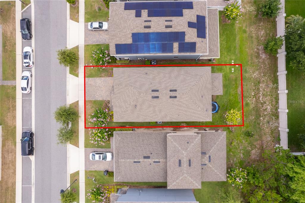 An aerial view shows a residential house with a red outline on its property lot — 2229 EMERALD SPRINGS, APOPKA, FL