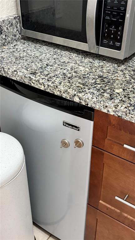 A black double-burner induction cooktop sits on a wooden surface against a white wall — 389 NOLANE LANE, POLK CITY, FL