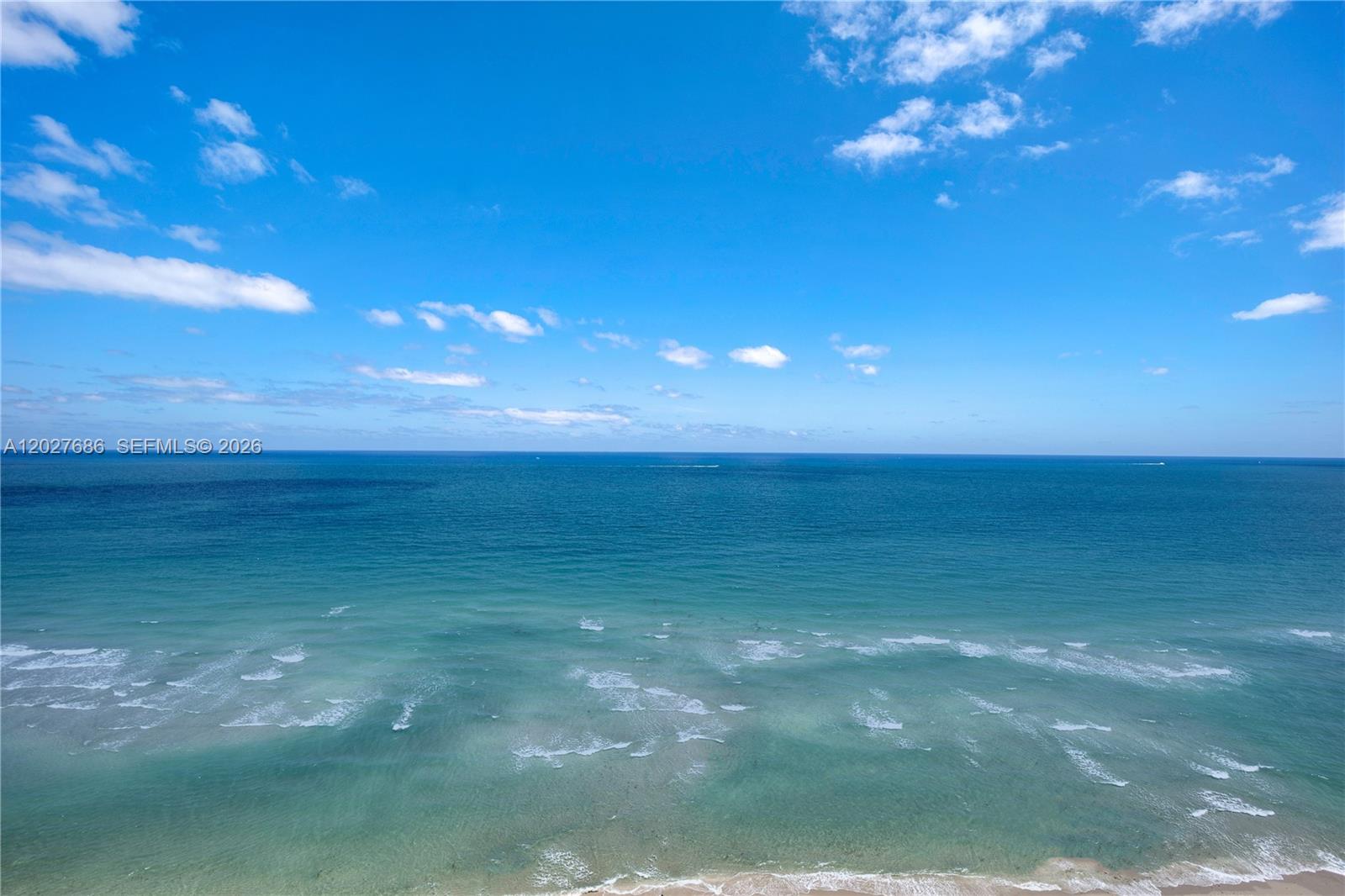 An elevated view of the ocean with a sandy beach and a blue sky — 2000 S Ocean Dr # 33A, Hallandale Beach FL 33009, HALLANDALE BEACH, FL