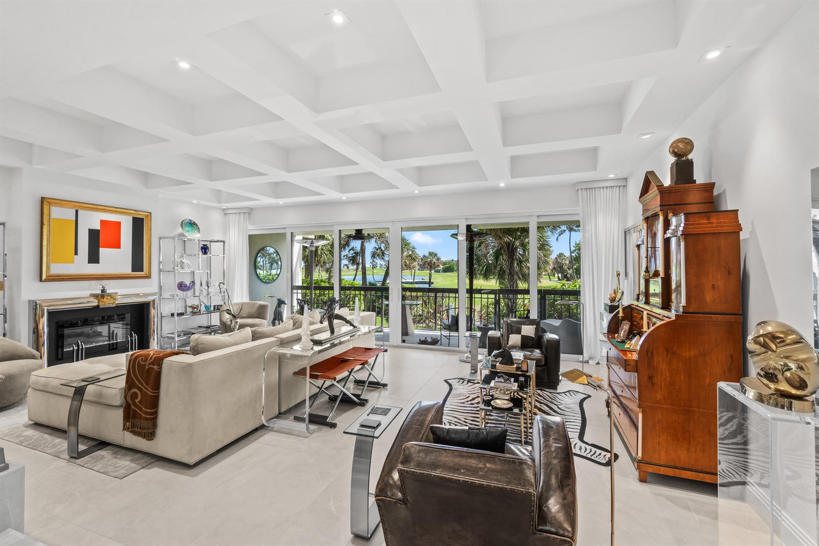 A bright living room features a coffered ceiling, fireplace, and large sliding doors to a balcony — 2335 S Ocean Boulevard # C9, Palm Beach FL 33480, PALM BEACH, FL