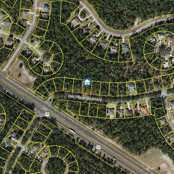 This is an aerial map showing residential lots and roads in a wooded area — 11 OAK VILLAGE BOULEVARD, HOMOSASSA, FL