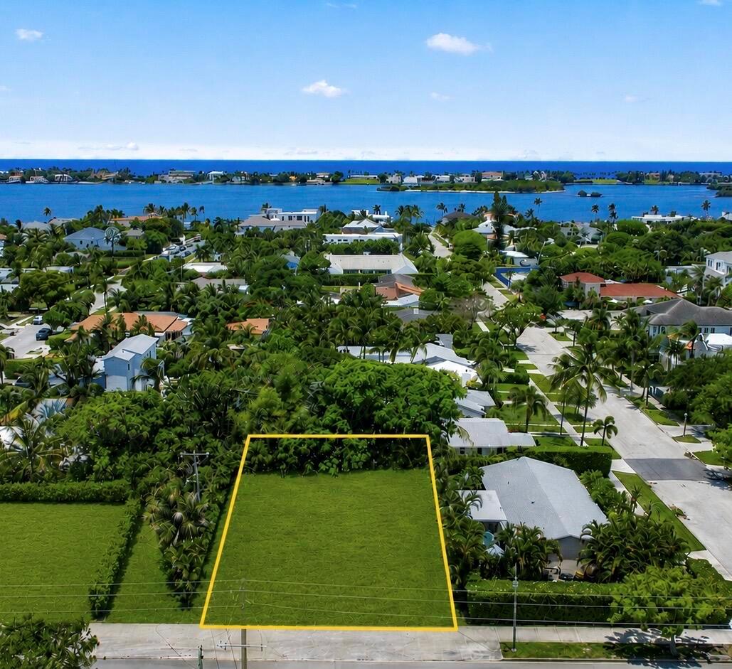 An aerial view shows a vacant rectangular lot outlined in yellow within a residential neighborhood — 6316 S Olive Avenue, West Palm Beach FL 33405, WEST PALM BEACH, FL