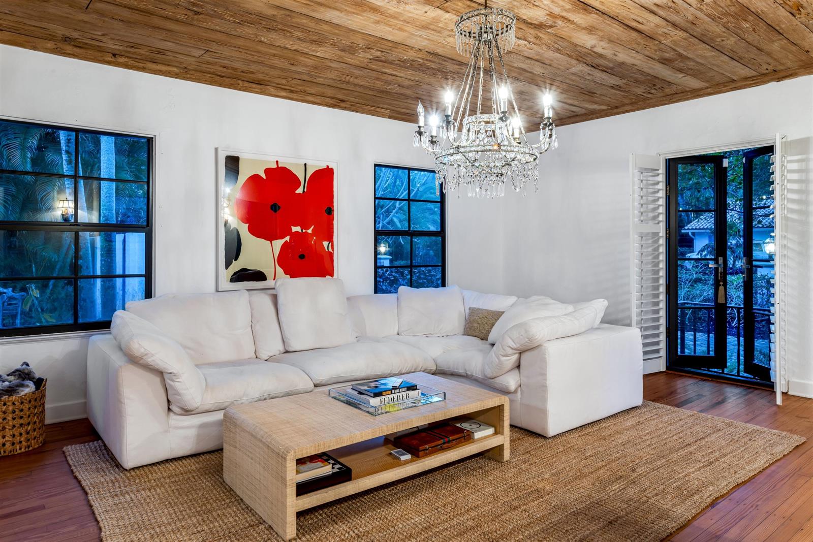 A living room features a white sectional sofa, a crystal chandelier, and a wood-plank ceiling — 755 Alamanda Street, Boca Raton FL 33486, BOCA RATON, FL